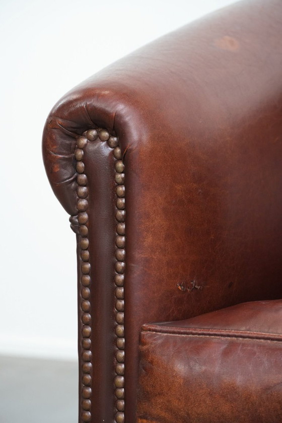 Image 1 of Vintage schapenleren clubfauteuil met siernagels