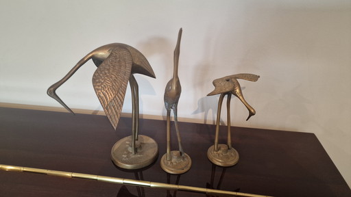 set of 3 brass cranes.