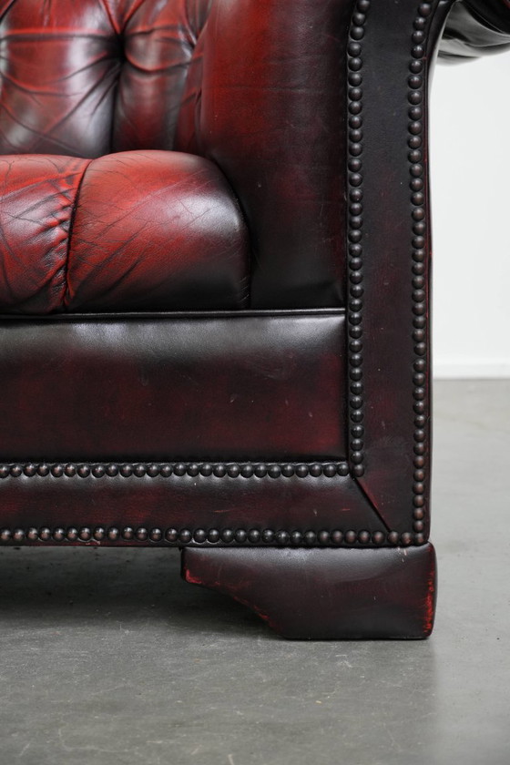 Image 1 of Rode rundleren chesterfield buttonseat fauteuil