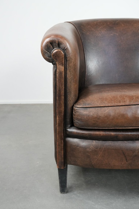 Image 1 of Sturdy and characterful vintage sheepskin club armchair