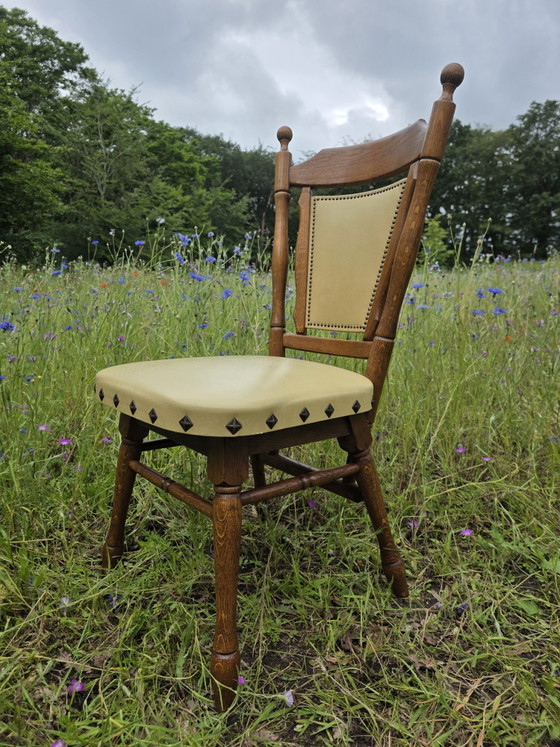 Image 1 of Set of 2 solid oak chairs with decorative nails