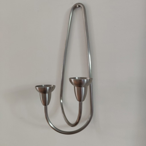 Bougeoir mural nommé "Swing" de la marque danoise Georg Jensen