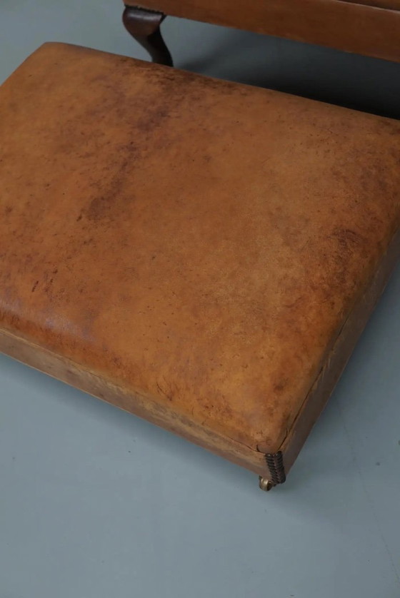 Image 1 of Vintage Nederlandse cognackleurige leren clubfauteuil met voetenbank