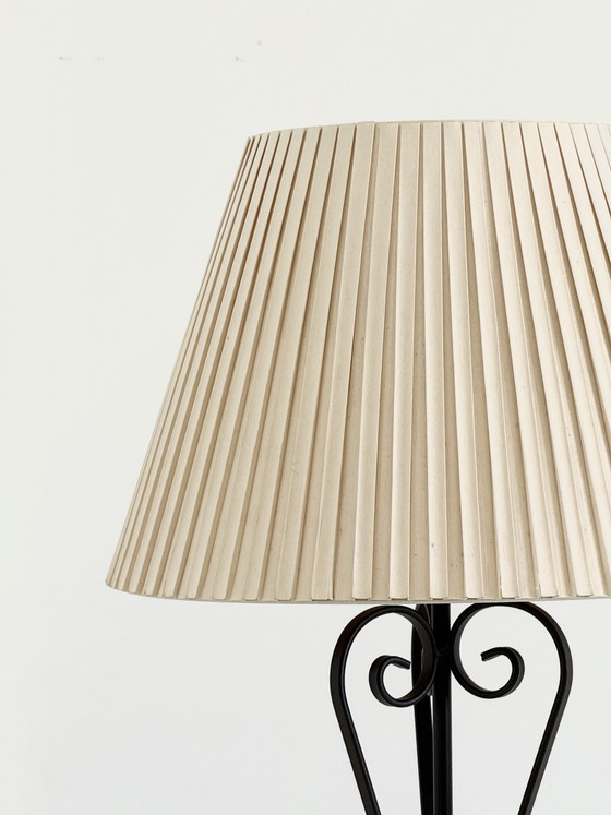 Image 1 of Vintage wrought iron table lamp in a swirl shape with a pleated shade