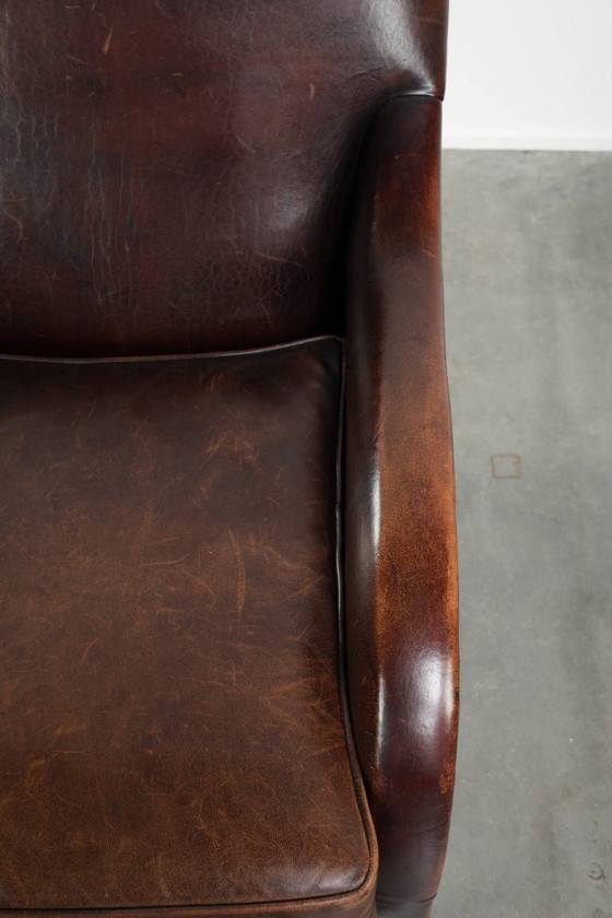 Image 1 of Poltrona di design in pelle di pecora in buone condizioni, con un bellissimo colore intenso e una seduta confortevole.