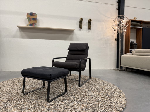 Poltrona Leolux Indra con poggiapiedi in tessuto pelle blu