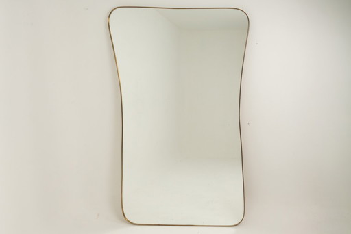 Miroir en laiton doré dans le style de Gio Ponti. Années 1980/90.