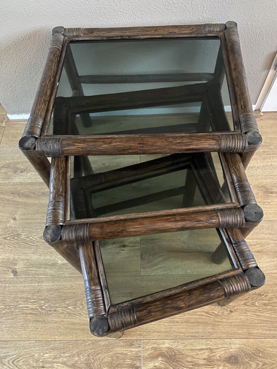 Image 1 of Vintage rattan bamboo nesting tables mimeset smoked glass