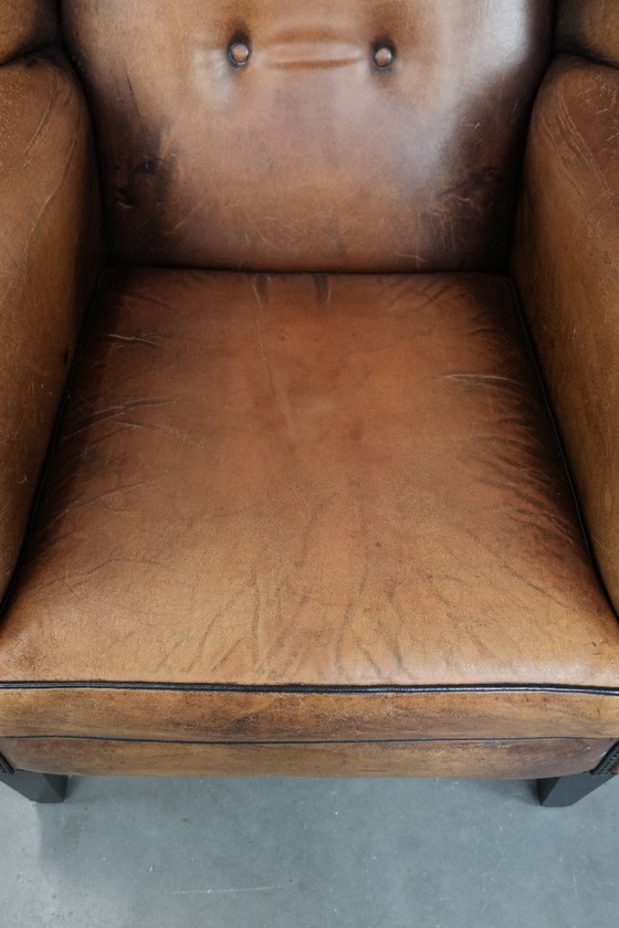 Image 1 of Sheepskin wing chair with a characterful appearance