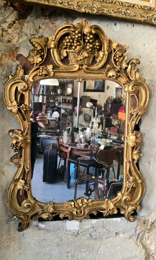 Louis XV period mirror in gilded wood and 18th century stucco leaf