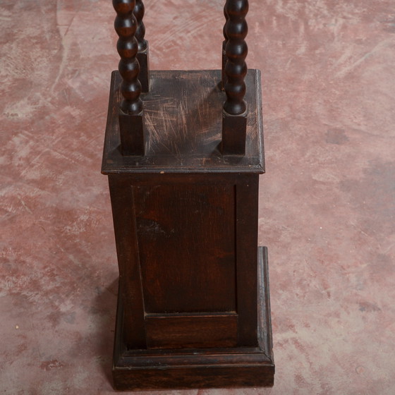 Porta piante da ingresso in legno scuro tornito (photo 11 of 15)