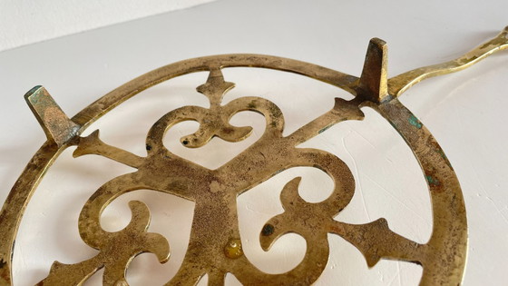 Image 1 of Solid brass trivet