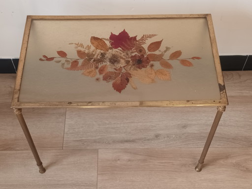 Bronze side table with pressed flowers