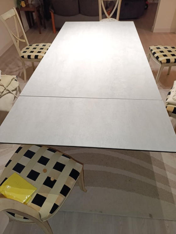 Image 1 of Roche Bobois - Table céramique de repas rectangulaire avec allonge / pied laqué