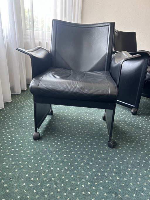Matteo Grassi 8 pieces of black leather chairs
