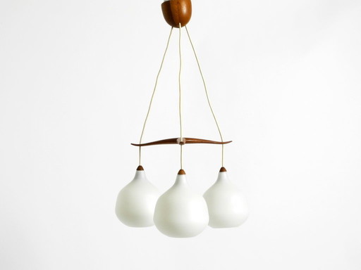 Beautiful pendant lamp with three opal glass shades and a teak frame by Uno & Östen Kristiansson for Luxus Vittsjö, Sweden 1957