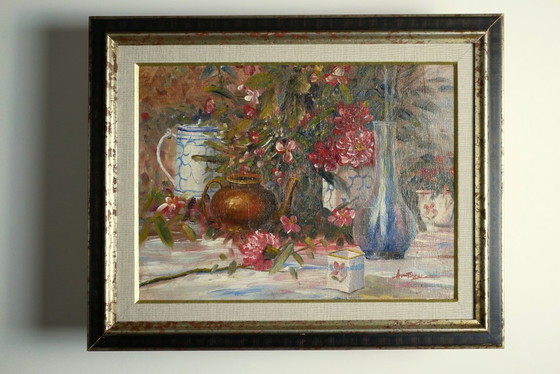 Image 1 of Still life with pink flowers and blue pots.
