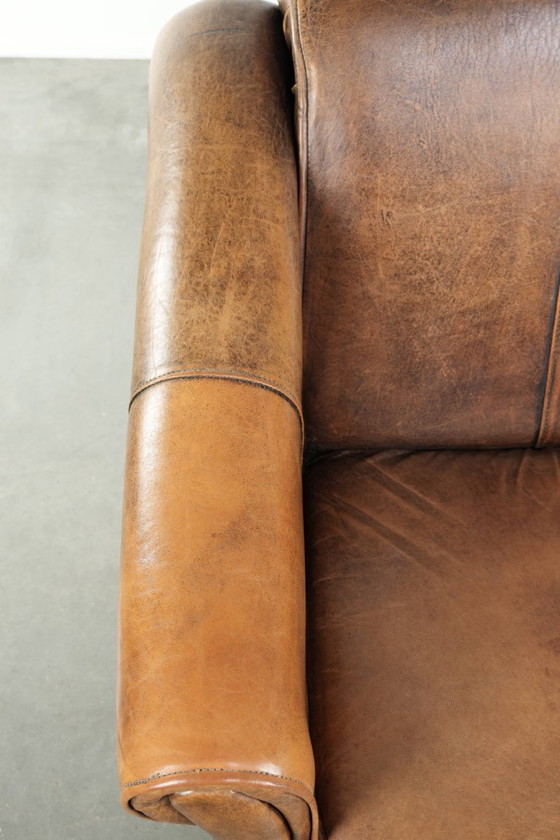 Image 1 of Fauteuil confortable en peau de mouton au style intemporel