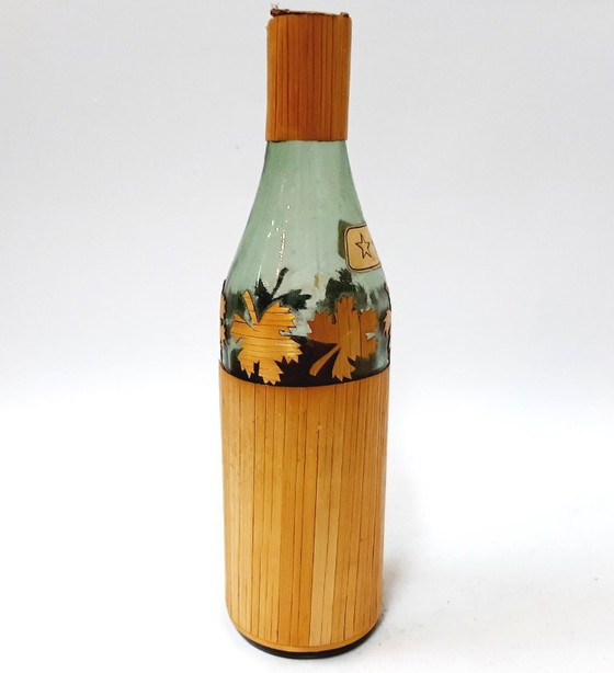 Image 1 of Vintage glazen fles omwikkeld met riet