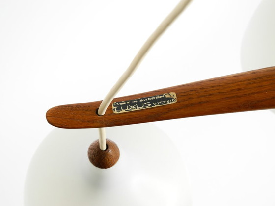 Image 1 of Beautiful pendant lamp with three opal glass shades and a teak frame by Uno & Östen Kristiansson for Luxus Vittsjö, Sweden 1957