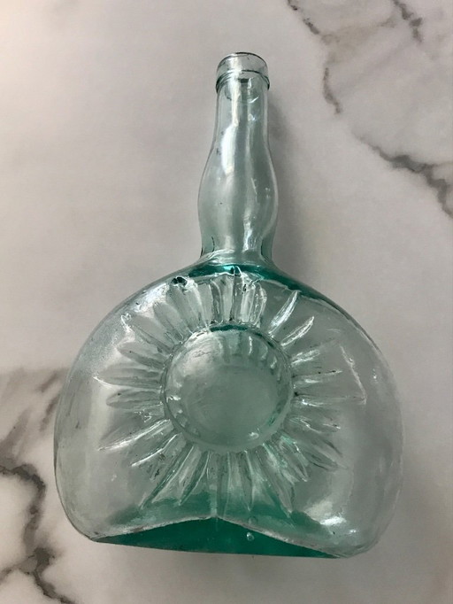 Sun-embossed bottle