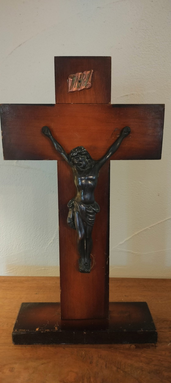 Image 1 of Small copper crucifix on a wooden plank