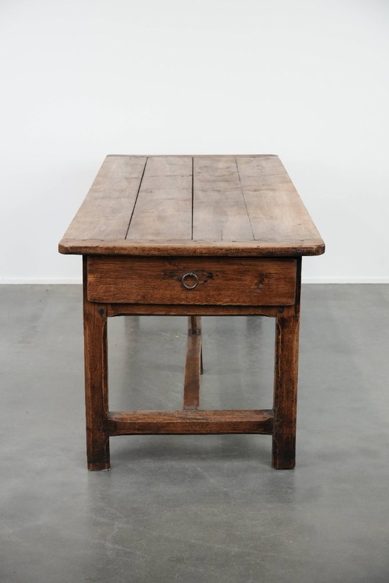 Image 1 of Robust antique French 6-person dining table made of fruit wood with 3 drawers from the late 18th century