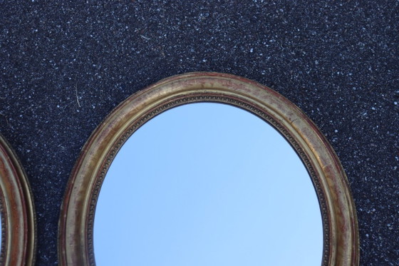 Image 1 of Pair of oval Louis Philippe period mirrors in giltwood