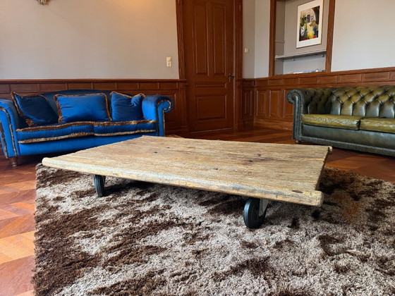 Image 1 of Unique industrial coffee table made of (monastery) wood on wheels