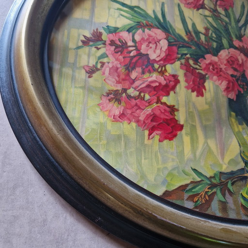 Antique printing print in oval frame behind glass flower painting
