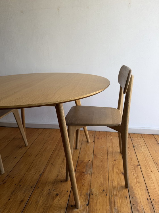 Image 1 of Round oak table with solid oak chairs