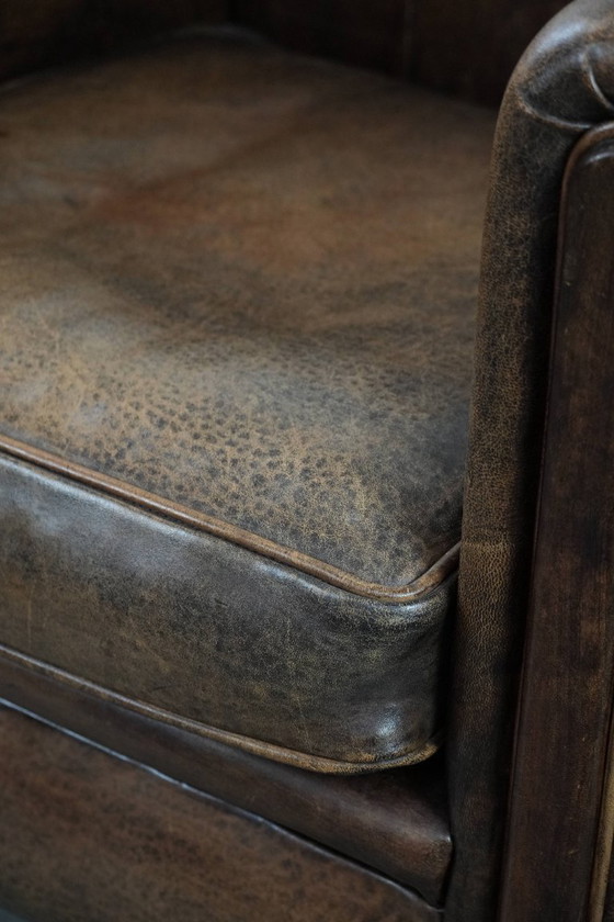 Image 1 of Vintage schapenleren fauteuil met een karaktervolle uitstraling