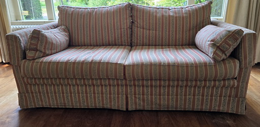 Joli canapé 2 places avec pouf