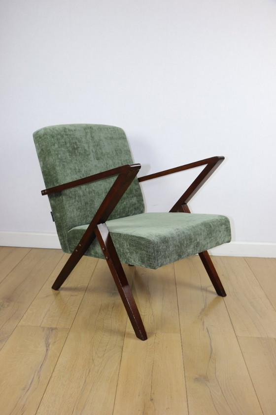 Image 1 of Vintage loft-fauteuil in olijfgroen, net als een spijkerbroek.