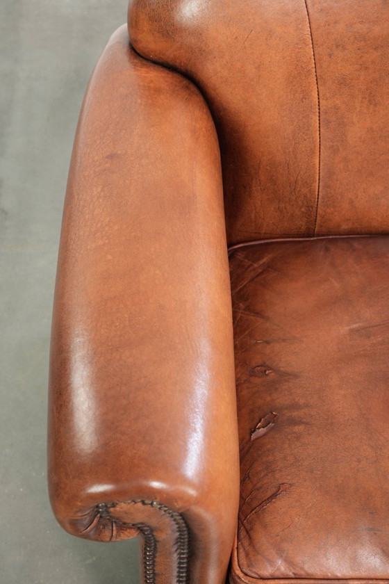 Comfortabele vintage schapenleren armchair afgewerkt met siernagels – Fauteuils, Leather, Klassiek (photo 7 of 12)
