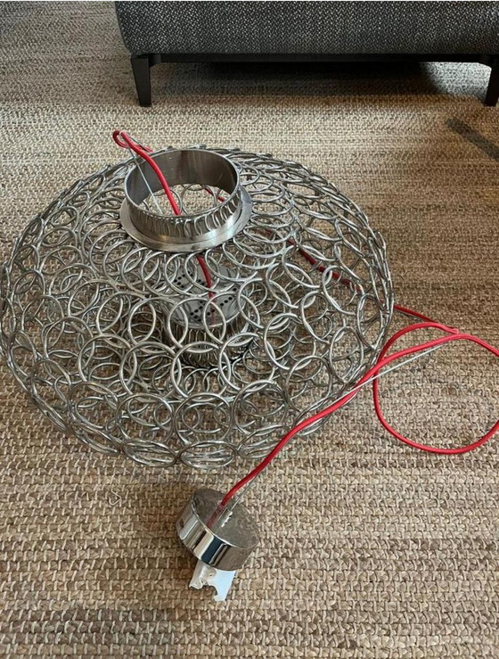 Image 1 of Découvrez l'art de la lumière : la suspension ovale Terzani GRA