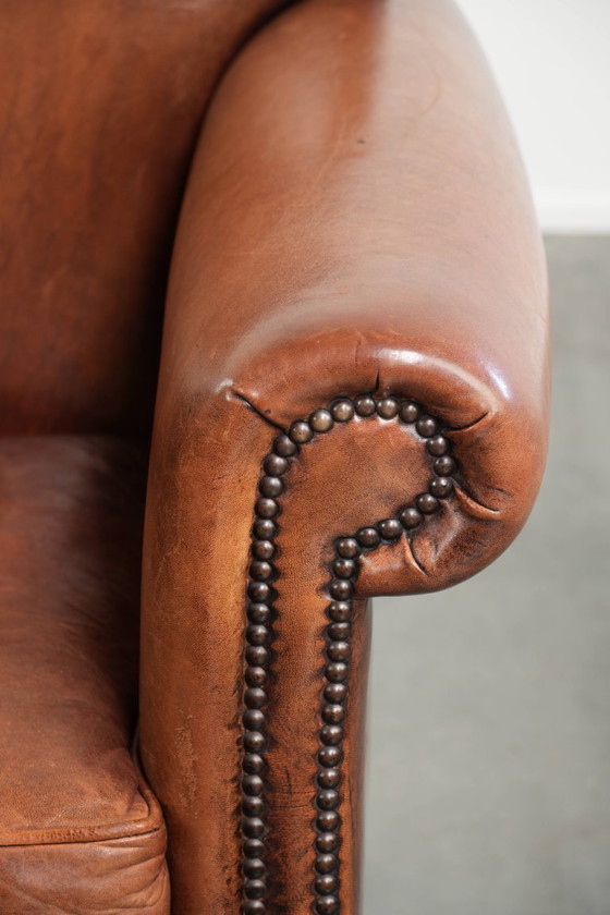 Vintage schapenleren armchair met een comfortabele zit en afgewerkt met siernagels – Fauteuils, Leather (photo 10 of 14)
