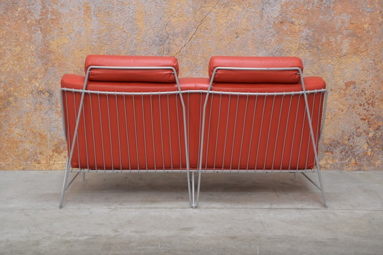 Image 1 of Red leather Leolux Volare design two-seater sofa
