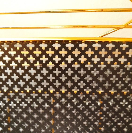 Image 1 of Revistero de metal perforado, 1950.