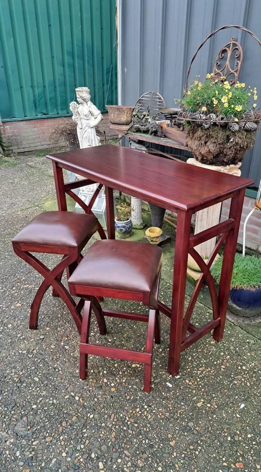 Mahogany wooden breakfast table with 2 chairs with leather upholstery dim. 107x47cm and 92cm high.