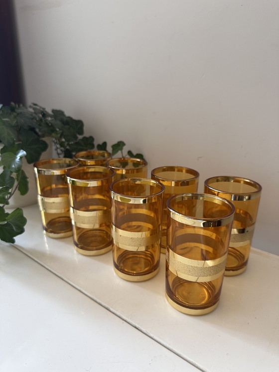Image 1 of Set of 8 gold/amber colored glasses