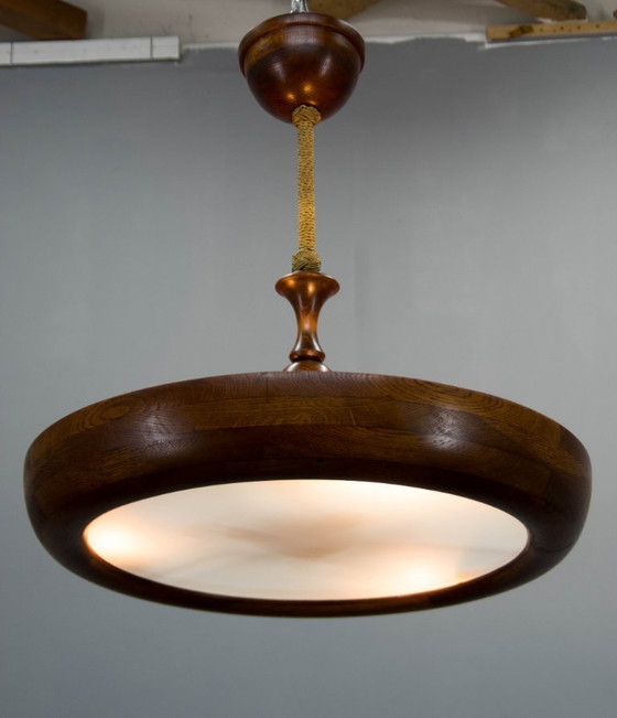 Image 1 of Grand lustre Art déco en bois en forme d'OVNI, années 1930