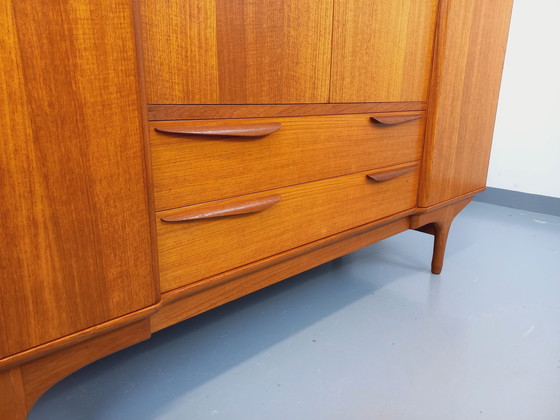 Image 1 of Scandinavische vintage kledingkast in teakhout uit de jaren 60 van ontwerpers Tricoire en Vecchione voor "Meubles TV Paris".