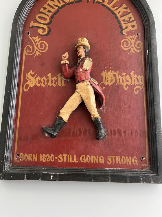 Image 1 of JOHNNIE WALKER – Original vintage wooden plaque with 3D relief figure “The Striding Man” (ca. 1970s)