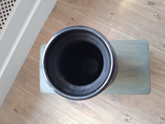 Image 1 of Tall black bakelite vase with unusual tulip decor, beautiful vintage object in very good and usable condition!