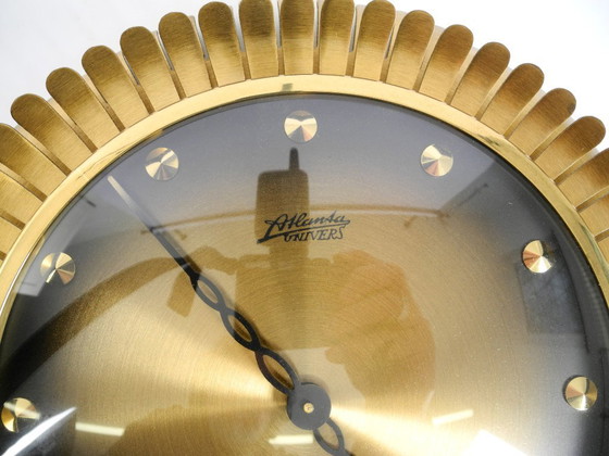 Image 1 of Beautiful original Mid Century Sunburst Atlanta Universe wall clock made of heavy brass with a mechanical seven-day movement