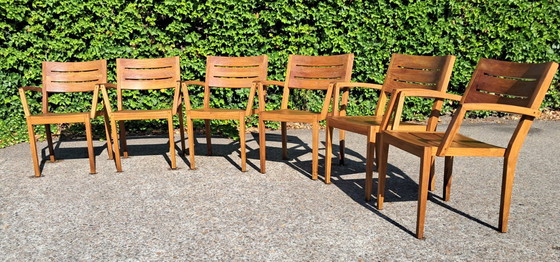 Image 1 of 6 Traditional Teak stacking chairs with armrests