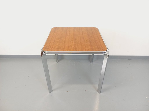 Tavolo da pranzo quadrato vintage Pierre Paulin in palissandro e metallo cromato degli anni '70