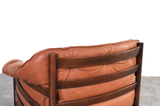 Sillones de roble y cuero de mediados de siglo, diseñados por Arne Norell para Coja en la década de 1960. (photo 15 of 16)