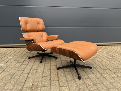 Poltrona lounge Vitra Eames XL + poggiapiedi, in pregiata pelle nera e palissandro Santos. NUOVA!!